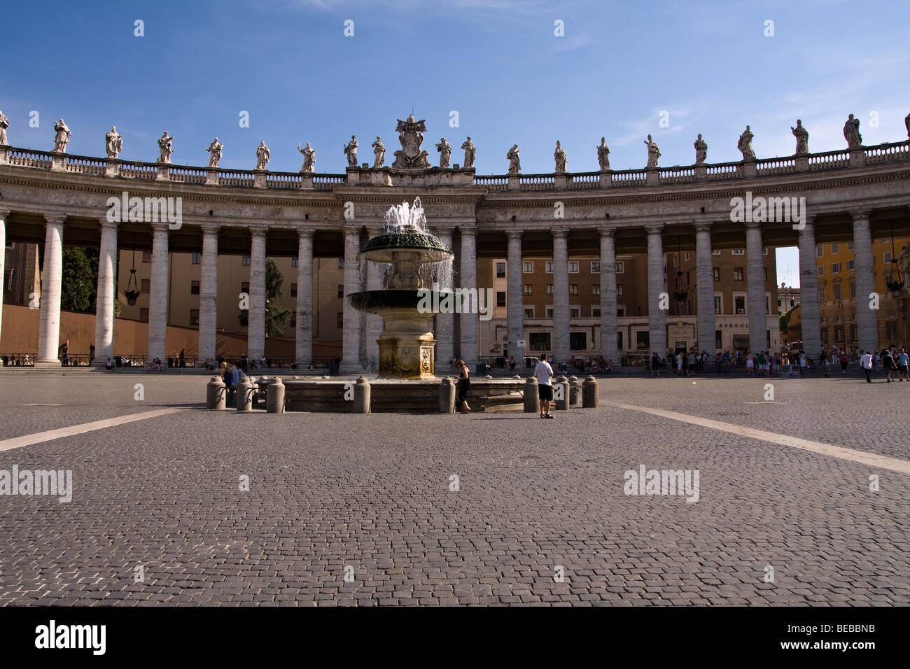 Bernini`s colonnade viewed from the centre of its arc Stock Photo